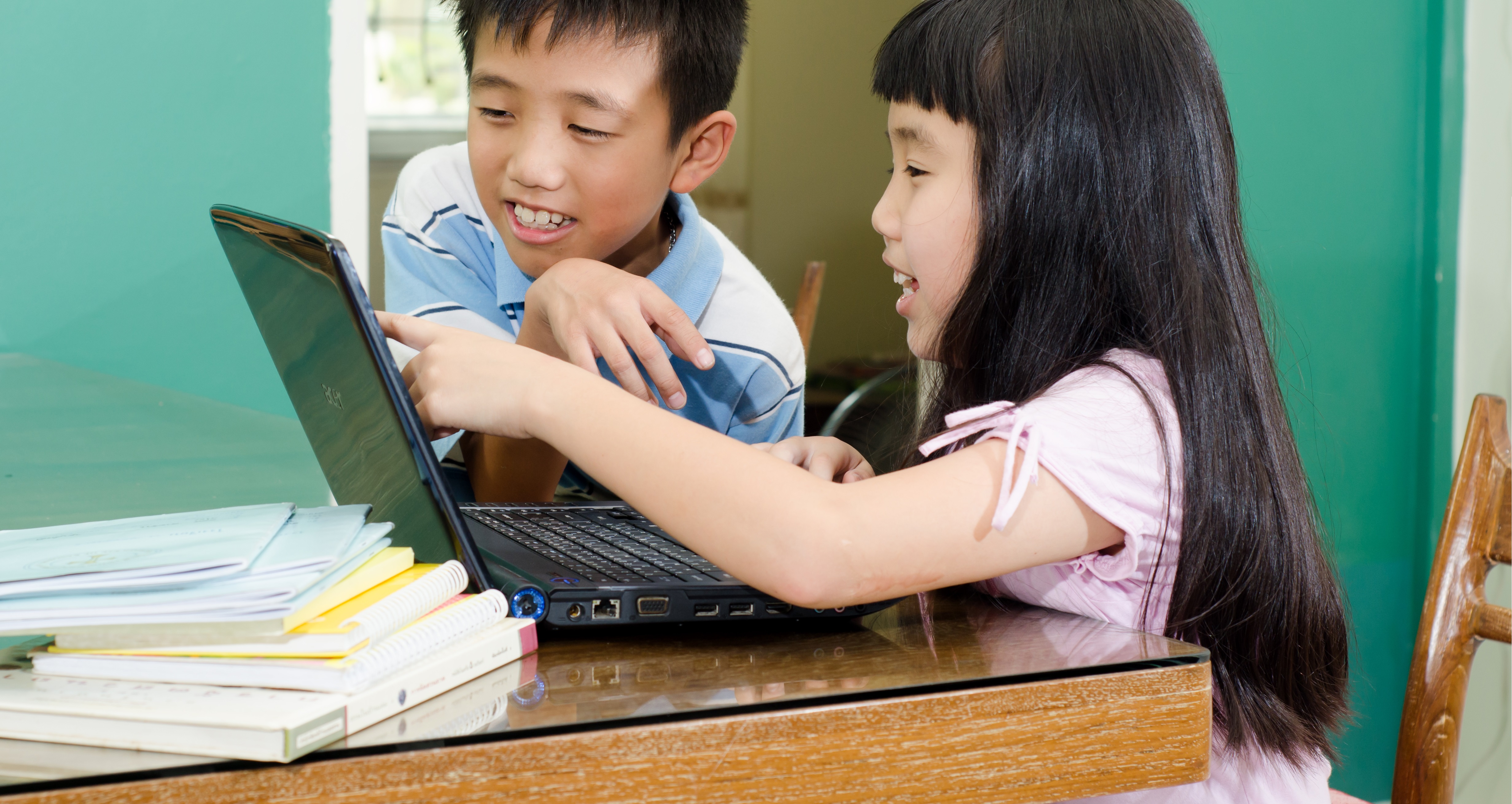 Learn i play. Boy and girl doing homework.